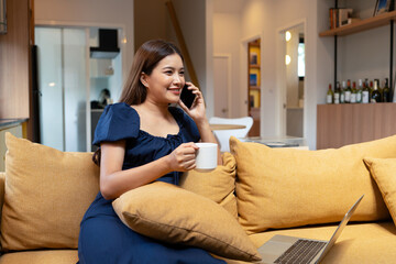 Woman enjoys book and music in modern abode.
