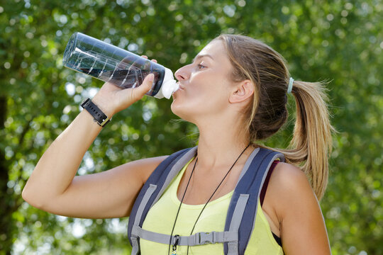 picture of a female hiker drinking water