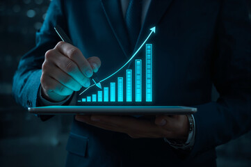 Person analyzing a glowing blue financial growth chart on a tablet
