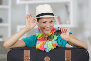 laughing playful young woman going on holidays