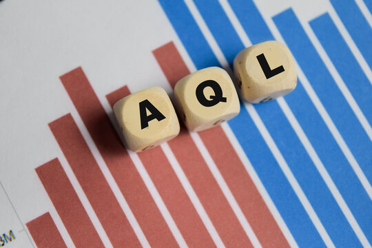 AQL - Acceptance Quality Limit stacked wooden cubes on the table.