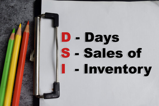 Concept of DSI - Days Sales of Inventory write on clipboard isolated on Wooden Table.