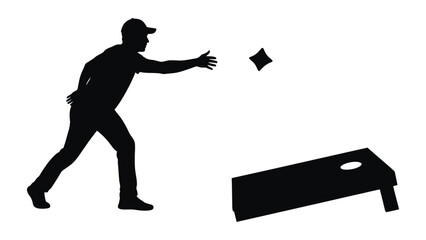 Silhouette of man playing cornhole game outdoor backyard activity