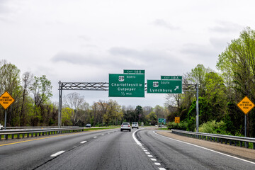 Virginia Blue Ridge highway i64 and cars driving to Charlottesville, Culpeper and Lynchburg in Spring forest trees season