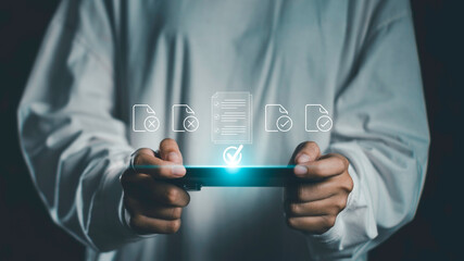 Person holding tablet with floating document icons representing compliance, workflow approval, and...