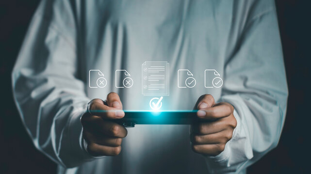 Person holding tablet with floating document icons representing compliance, workflow approval, and digital document management for secure, automated, and streamlined business process operations.