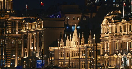 Shanghai, China. China Merchants Bank Building and Great Northern Telegraph Building at night time....