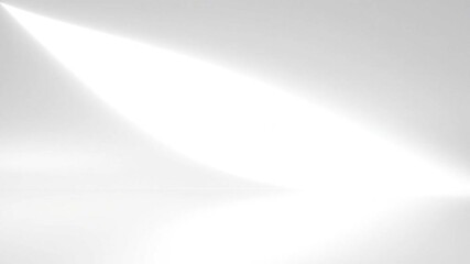 A minimalist white background with a bright spotlight shining from the upper left corner area