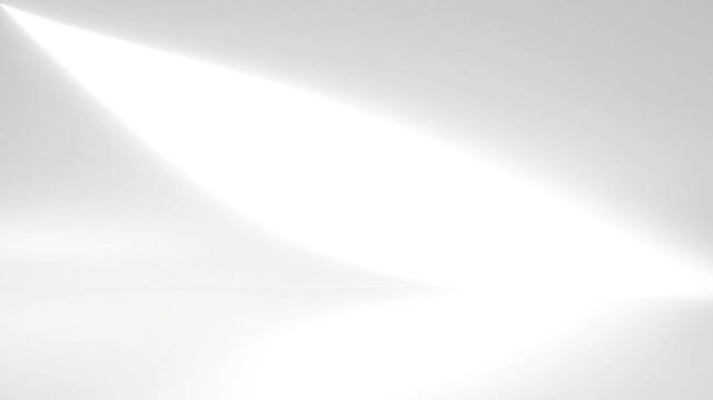 A minimalist white background with a bright spotlight shining from the upper left corner area