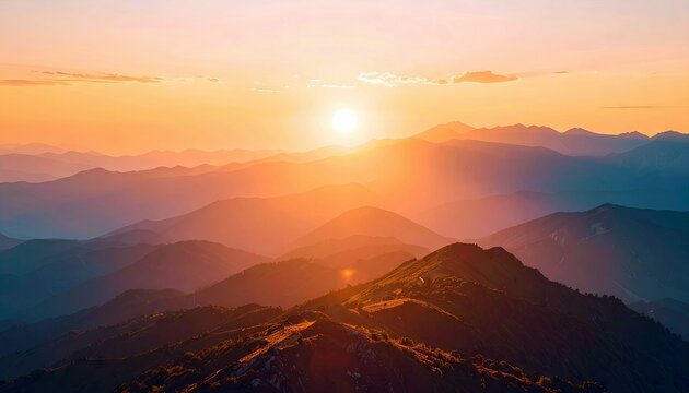 A scenic view of a mountain range at sunset, bathed in warm, golden light. The sun is setting in the distance, creating a beautiful and peaceful landscape.