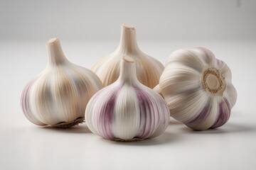 Four fresh garlic bulbs isolated on white background