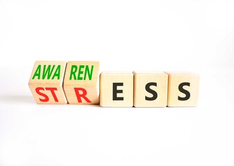Awareness or stress symbol. Concept words Awareness or Stress on beautiful wooden cubes. Beautiful white background. Business, psychological awareness or stress concept. Copy space.