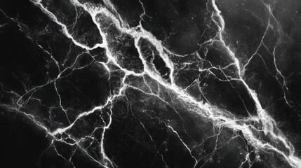 Black Marquina marble texture with white veins and copy space.