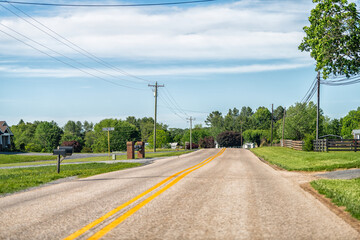 Fototapeta premium Lyndhurst, Virginia rural countryside village town in Augusta county with farm house buildings by road highway street at Blue Ridge mountains