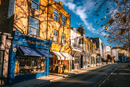Scenic view of small shops and stores located in traditional townhouses atop Richmond Hill on a cold, late autumn, winter day in Richmond, London, UK