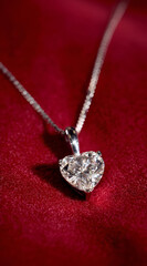 A stunning heart-shaped diamond pendant necklace glistens against a rich red background, symbolizing love and elegance.