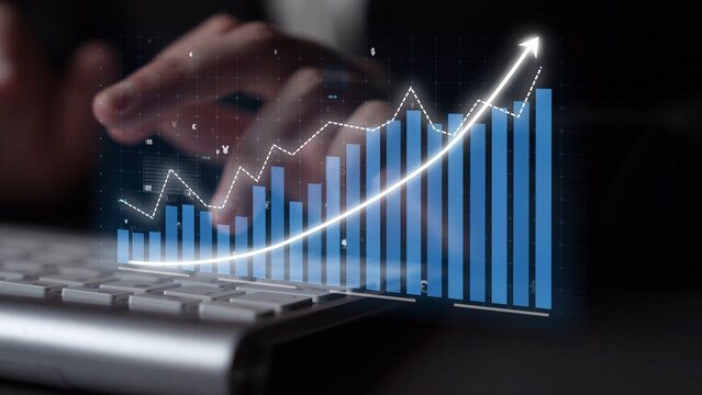 Close-up view of hands typing on a keyboard with an overlay of a digital graph demonstrating growth and success, symbolizing data analysis and business performance. Copula