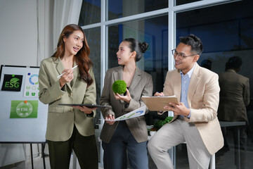 Business colleagues having a meeting, discussing environmental social governance - ESG - strategy and sustainability projects in the office