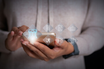 Hands holding smartphone with digital banking and online payment icons, representing mobile finance, e-commerce, and fintech services.