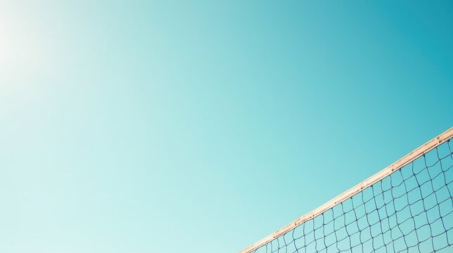 Bright Sunny Day with Volleyball Net Against Clear Blue Sky Providing a Perfect Setting for Outdoor Sports Activities and Summer Fun 
