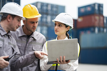 Caucasian woman logistics workers working with man worker at container site	