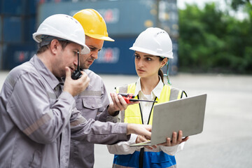 Caucasian woman logistics workers working with man worker at container site	