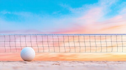 A white volleyball sits on the sand in front of a net, with a colorful sunset sky in the background.