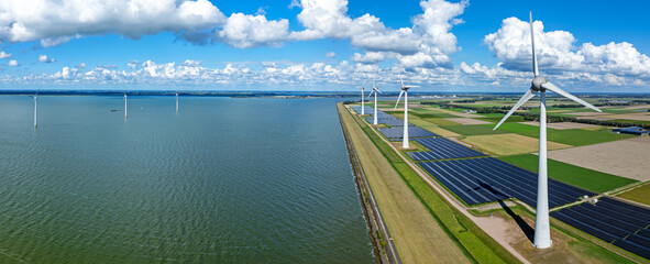 Aerial panorama from wind turbines and solar panels at the IJsselmeer in the Netherlands