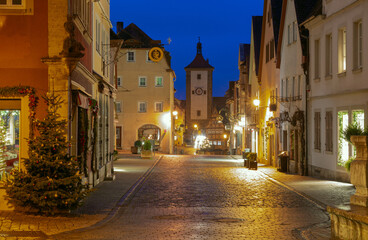Decorated street with Christmas lights in Rothenburg ob der Tauber Germany at night