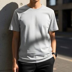 Front view of a male model in a light grey t-shirt and black pants, urban fashion apparel mockup
