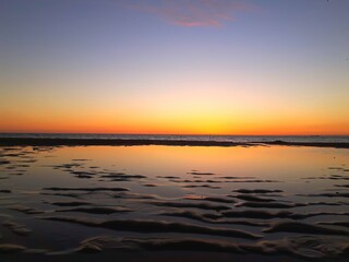 Obraz premium Sunset Over the North Sea at The Hague, Low Tide by the Beach Beautiful 