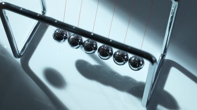 Newton's Cradle Pendulum Physics Demonstration with Chrome Steel Balls in Motion