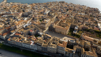 Aerial view of Duomo Square and Cathedral of Syracuse, formally Cathedral of the Nativity of the Blessed Virgin Mary. It's located in the center of the city, on the island of Ortygia, Sicily, Italy.