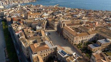 Aerial view of Duomo Square and Cathedral of Syracuse, formally Cathedral of the Nativity of the Blessed Virgin Mary. It's located in the center of the city, on the island of Ortygia, Sicily, Italy.