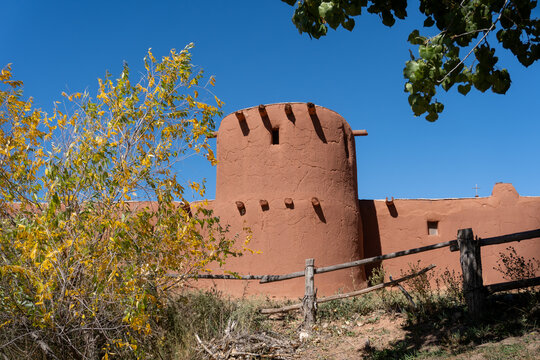 Torre&oacute;n (watch tower) for El Rancho de Las Golondrinas (The Ranch of the Swallows), historic rancho, now a living history museum near Santa Fe, New Mexico. Adobe walls, cottonwood tree. 