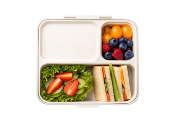 Bento box containing sandwiches fresh vegetables and mixed berries, isolated on a transparent background