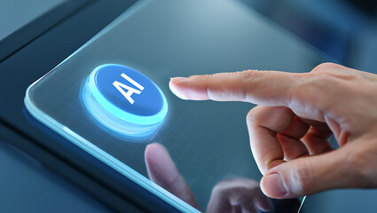 Close up of a human finger pressing a glowing blue button with the letters ai on a futuristic digital interface screen