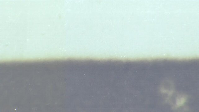 Looping microfiche scan transition in vertical and horizontal formats. Perfect for blending modes, archival looks and retro visual design.