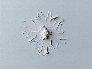 Close-up of a white painted flower with textured brushstrokes on a canvas background. The image has a minimalist and artistic aesthetic.