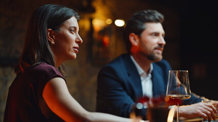 Relaxed people speaking bar counter drinking alcohol beverages evening closeup