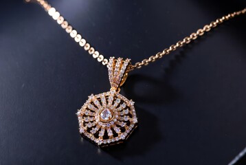 Golden Necklace's Opulence: A captivating view of a stunning pendant necklace resting gracefully, its delicate chain and ornate design highlighting its captivating beauty. 