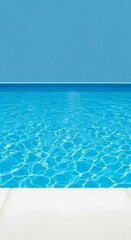 Obraz premium A serene shot showcasing a rectangular pool filled with clear, sparkling water under a bright blue sky. A white edge defines the pool's border