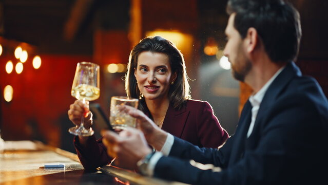 Closeup woman flirting man in nightclub party. Relaxed couple drinking cocktails - Powered by Adobe