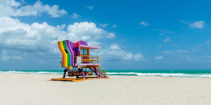 Rainbow colorful lifeguard station tower hut and the ocean in South Beach, Miami Beach, Florida