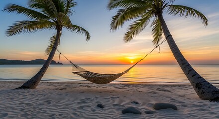 A serene tropical scene. A woven hammock is strung between two palm trees at sunset, with a tranquil beach and ocean