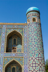 Uzbekistan architecture in Samarkand and Bukhara with intricate mosaics blue domes ancient madrasas Islamic patterns historic monuments vibrant tilework and cultural heritage in bright daylight