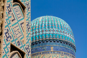 Uzbekistan architecture in Samarkand and Bukhara with intricate mosaics blue domes ancient madrasas Islamic patterns historic monuments vibrant tilework and cultural heritage in bright daylight