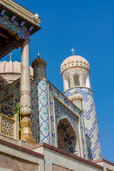 Uzbekistan architecture in Samarkand and Bukhara with intricate mosaics blue domes ancient madrasas Islamic patterns historic monuments vibrant tilework and cultural heritage in bright daylight