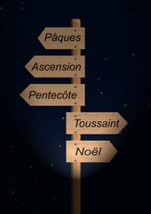 Dans la nuit un panneau indiquant les f&ecirc;tes religieuses chr&eacute;tiennes