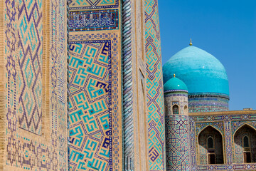 Uzbekistan architecture in Samarkand and Bukhara with intricate mosaics blue domes ancient madrasas Islamic patterns historic monuments vibrant tilework and cultural heritage in bright daylight